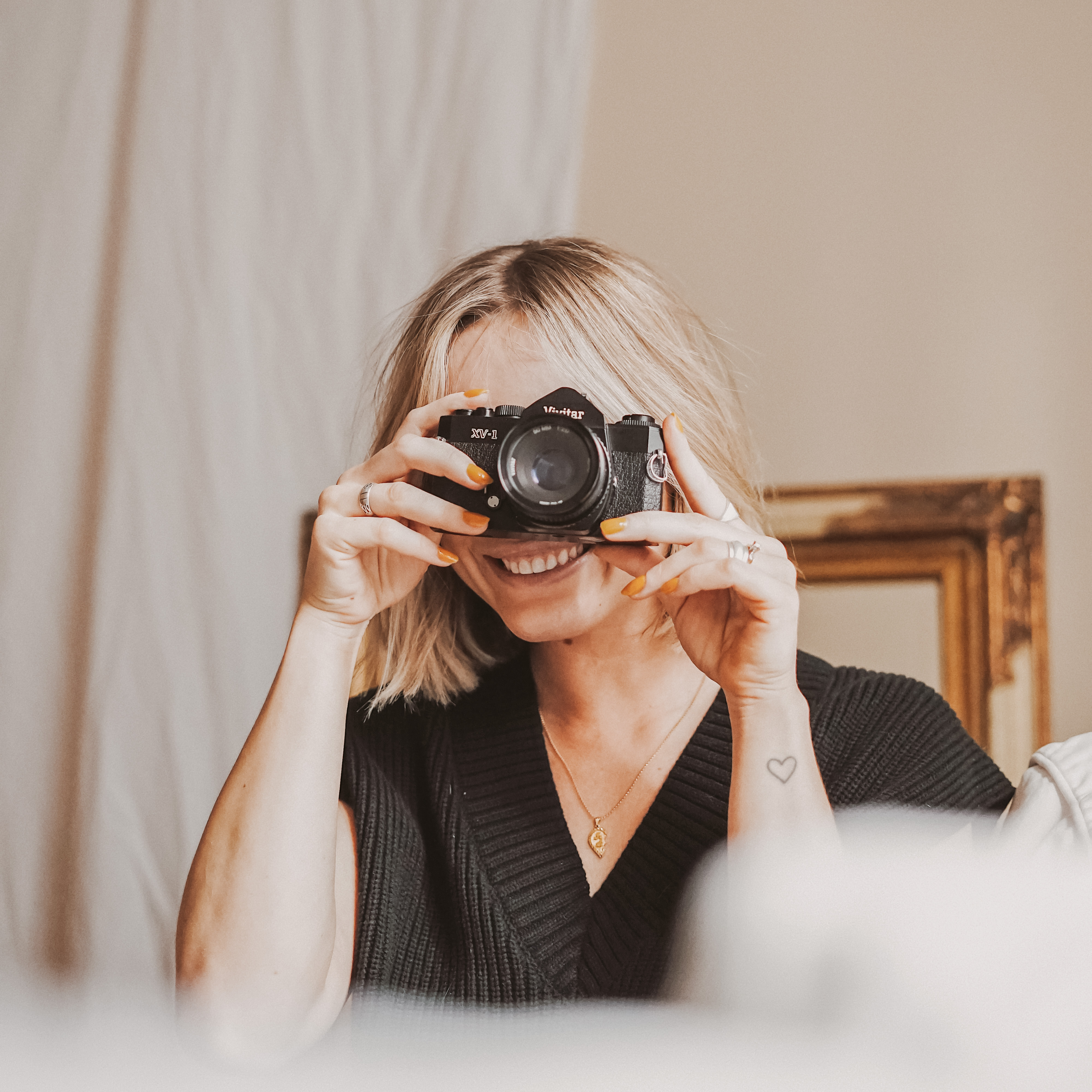 Girl Holding a Camera